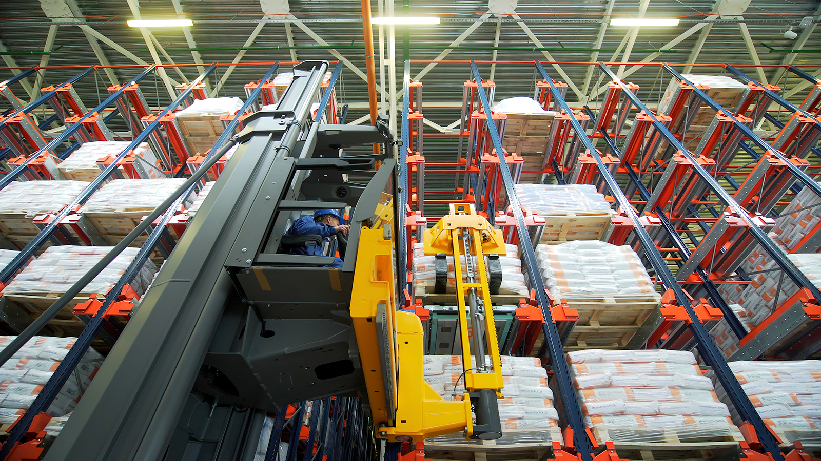 Storage.Creative.A man who arranges boxes and uses special vehicles for delivery.